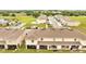 Townhome exteriors showing backyard patios, common grassy areas, and mature trees at 200 Feltrim Reserve Blvd, Davenport, FL 33837