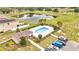 Aerial shot of pool, cabana and surrounding homes; landscaped community for recreation and outdoor living at 200 Feltrim Reserve Blvd, Davenport, FL 33837