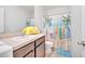 Bathroom with beach themed shower curtain, sink and vanity at 200 Feltrim Reserve Blvd, Davenport, FL 33837