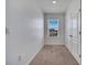 Bedroom featuring a window with a view and carpet flooring at 200 Feltrim Reserve Blvd, Davenport, FL 33837