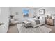 Cozy bedroom with a tufted headboard bed, stylish decor, and a bright window at 200 Feltrim Reserve Blvd, Davenport, FL 33837