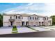 New townhome exteriors with attached garages, enhanced by landscaping and contemporary design features at 200 Feltrim Reserve Blvd, Davenport, FL 33837
