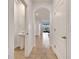 Bright hallway leading to powder room, entry, and living area at 200 Feltrim Reserve Blvd, Davenport, FL 33837
