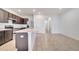 This kitchen features stainless steel appliances, a breakfast bar and easy access to the rest of the home at 200 Feltrim Reserve Blvd, Davenport, FL 33837
