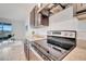 This kitchen features stainless steel appliances and is adjacent to the bright and airy living area at 200 Feltrim Reserve Blvd, Davenport, FL 33837