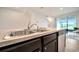 This spacious kitchen features stainless steel sinks and appliances and plenty of counter space at 200 Feltrim Reserve Blvd, Davenport, FL 33837