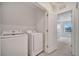 Bright laundry room with modern washer and dryer units at 200 Feltrim Reserve Blvd, Davenport, FL 33837