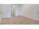 Open living area with tile floors and easy access to the kitchen and powder room at 200 Feltrim Reserve Blvd, Davenport, FL 33837