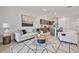 Open-concept living room with modern furnishings connecting seamlessly to the kitchen at 200 Feltrim Reserve Blvd, Davenport, FL 33837