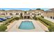 Inviting community pool area surrounded by a black fence and manicured landscape, offering a relaxing atmosphere at 200 Feltrim Reserve Blvd, Davenport, FL 33837