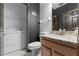 Modern bathroom features sleek vanity, stylish mirror, and convenient washer/dryer setup at 2041 Lacie Jo Ln, Kissimmee, FL 34743