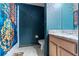Whimsical bathroom with blue Harry Potter themed shower curtain and decor at 2041 Lacie Jo Ln, Kissimmee, FL 34743