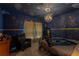 Bedroom featuring custom constellations, stylish light fixture, tile floors, and comfortable seating at 2041 Lacie Jo Ln, Kissimmee, FL 34743