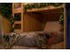 Themed bedroom with custom wooden bunkbeds and nature themed decor at 2041 Lacie Jo Ln, Kissimmee, FL 34743
