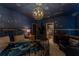 Stylish bedroom featuring a custom constellation theme, decorative light fixture, and ensuite bathroom at 2041 Lacie Jo Ln, Kissimmee, FL 34743