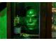 Close-up of a green mask and potion labeled 'Mandrake Elixir' inside a themed cabinet at 2041 Lacie Jo Ln, Kissimmee, FL 34743