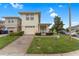 Charming two-story home featuring a well-manicured lawn, brick driveway and attached garage at 2041 Lacie Jo Ln, Kissimmee, FL 34743