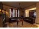 Living room showcases leather couches, stone-look walls, and themed decorations and lighting at 2041 Lacie Jo Ln, Kissimmee, FL 34743