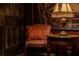 Cozy sitting area with decorative chair, side table, and lamp at 2041 Lacie Jo Ln, Kissimmee, FL 34743