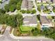 Aerial view of a home with a well-maintained lawn, charming landscaping, and neighborhood streets at 2071 Remembrance Ave, St Cloud, FL 34769