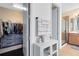 Hallway view of a bathroom featuring a walk-in shower, cabinets, and a walk-in closet at 2071 Remembrance Ave, St Cloud, FL 34769