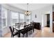 Bright dining room featuring lots of windows, modern lighting, and tile floors at 2071 Remembrance Ave, St Cloud, FL 34769