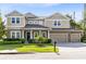 Charming two-story home with a well-manicured lawn and a three-car garage at 2071 Remembrance Ave, St Cloud, FL 34769