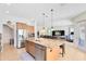 Modern kitchen with stainless steel appliances, tile flooring, and large island at 2071 Remembrance Ave, St Cloud, FL 34769