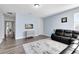 Relaxing living room with modern decor and comfortable leather seating at 2071 Remembrance Ave, St Cloud, FL 34769