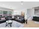 Open-concept living area with view to kitchen and staircase at 2071 Remembrance Ave, St Cloud, FL 34769