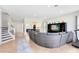 Spacious living area with tile floors, neutral wall color, and staircase at 2071 Remembrance Ave, St Cloud, FL 34769