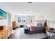 Comfortable main bedroom with a bed, dresser, ensuite bath, and lots of natural light at 2071 Remembrance Ave, St Cloud, FL 34769