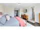 Spacious main bedroom features a king bed, dresser, and ensuite bathroom at 2071 Remembrance Ave, St Cloud, FL 34769