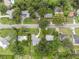 Aerial view of a neighborhood with mature trees, well-maintained homes, and green lawns at 209 Wilmer Ave, Orlando, FL 32811