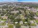 Expansive aerial view of a neighborhood with lush trees and manicured lawns, showcasing community charm at 209 Wilmer Ave, Orlando, FL 32811
