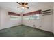 Bedroom with carpet flooring, a ceiling fan, natural light, and window air conditioning unit at 209 Wilmer Ave, Orlando, FL 32811