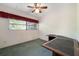 Bedroom with carpet flooring, a ceiling fan, and natural light coming through the window at 209 Wilmer Ave, Orlando, FL 32811