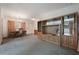 Open-concept room showcasing a wooden entertainment center, adjacent to a dining area at 209 Wilmer Ave, Orlando, FL 32811