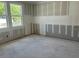 This bedroom with two windows features fresh drywall, and natural light at 2292 Broadbrook Drive, St Cloud, FL 34771