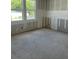Bedroom with fresh drywall, two windows, and a sunny view at 2292 Broadbrook Drive, St Cloud, FL 34771