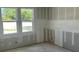 Unfinished bedroom featuring drywall and two windows providing natural light at 2292 Broadbrook Drive, St Cloud, FL 34771