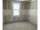 Bright bedroom showcasing fresh drywall, a window, and awaiting final touches at 2292 Broadbrook Drive, St Cloud, FL 34771