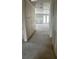Interior view of a home under construction with unfinished walls, concrete floor, and a view of other rooms at 2292 Broadbrook Drive, St Cloud, FL 34771