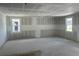 Spacious room in a home under construction with unfinished walls, concrete floor, and a window with exterior view at 2292 Broadbrook Drive, St Cloud, FL 34771