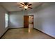 This bedroom features tiled floors, ceiling fan, and plenty of natural light at 2334 W Doris St, Kissimmee, FL 34741