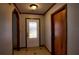 Inviting entryway with tiled flooring, a decorative front door, and neutral wall paint at 2334 W Doris St, Kissimmee, FL 34741