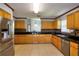 Spacious kitchen boasts stainless steel appliances, tile flooring, and plenty of cabinet space for storage at 2334 W Doris St, Kissimmee, FL 34741