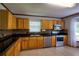 Well-lit kitchen with stainless steel appliances, tiled backsplash, and ample cabinet space at 2334 W Doris St, Kissimmee, FL 34741