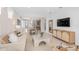 Bright, open-concept living area with modern decor and plenty of natural light flowing through the windows at 2338 Lily Bloom Rd, St Cloud, FL 34771