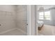 Walk-in closet with wire shelving, and bedroom view, providing ample storage and functionality at 2338 Lily Bloom Rd, St Cloud, FL 34771